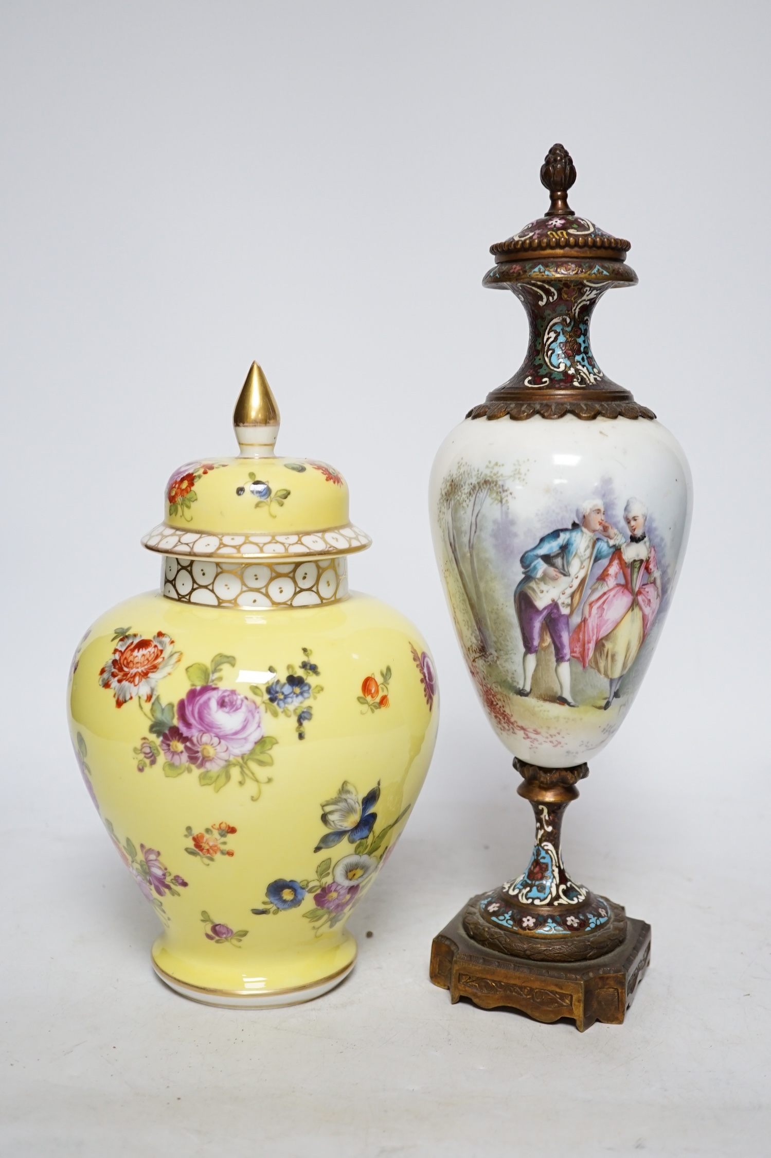 A 19th century French ormolu, enamel and porcelain urn and cover and a Dresden yellow urn and cover, tallest 31cm